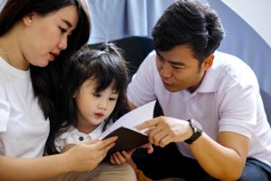 parents reading asian child support